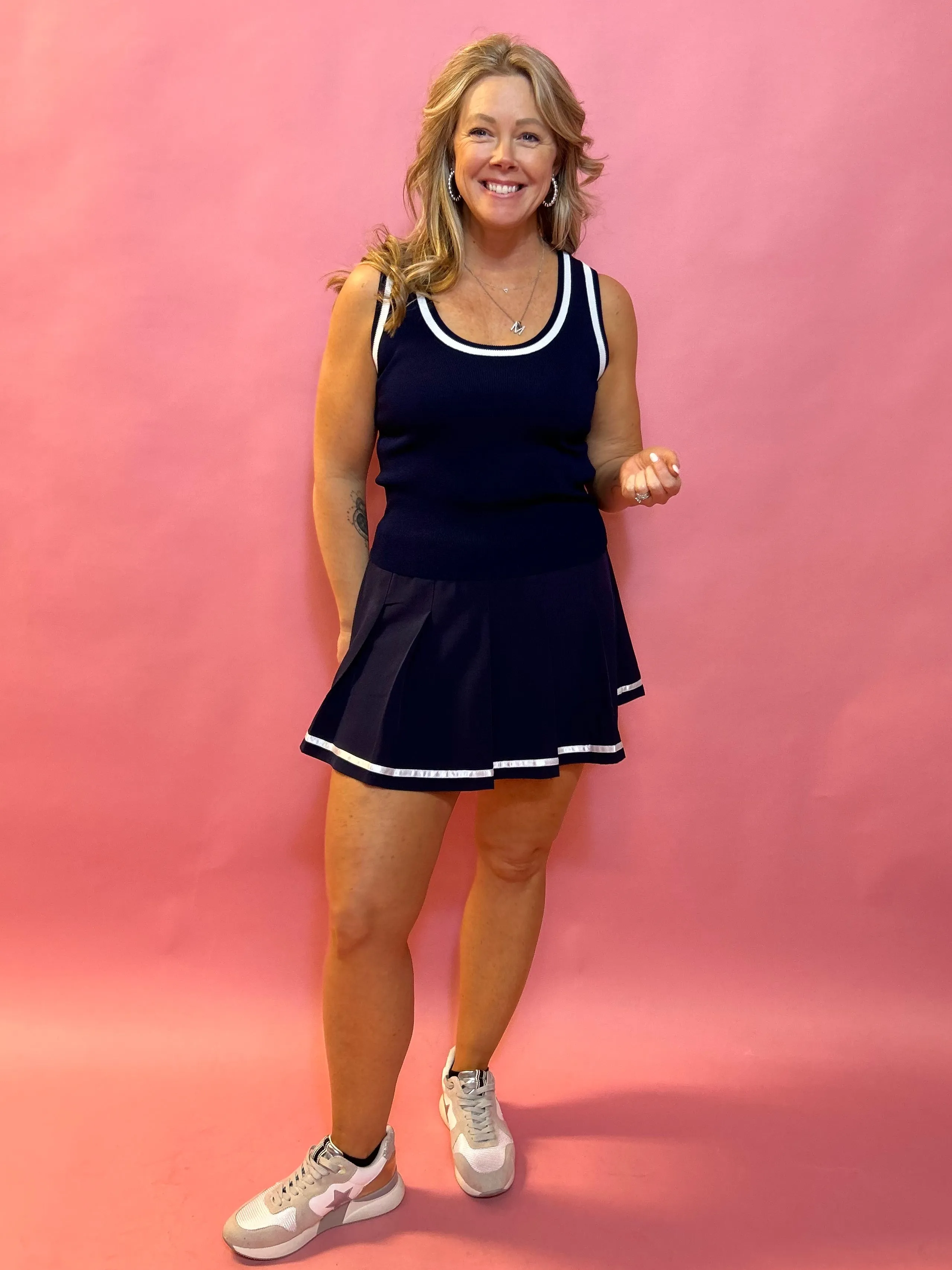 Sporty Elegance: Sleeveless Sweater Vest with Navy Trim