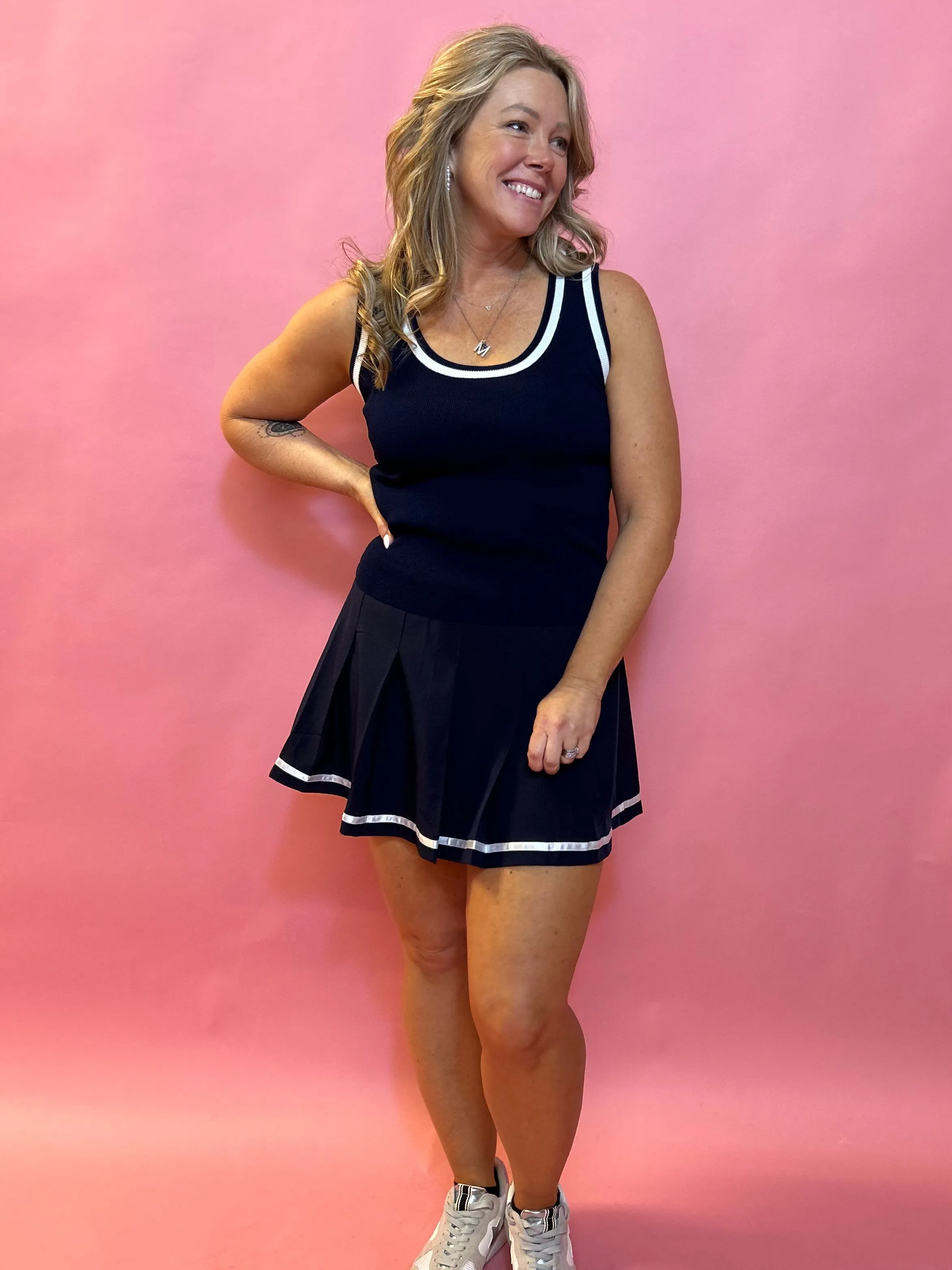 Sporty Elegance: Sleeveless Sweater Vest with Navy Trim